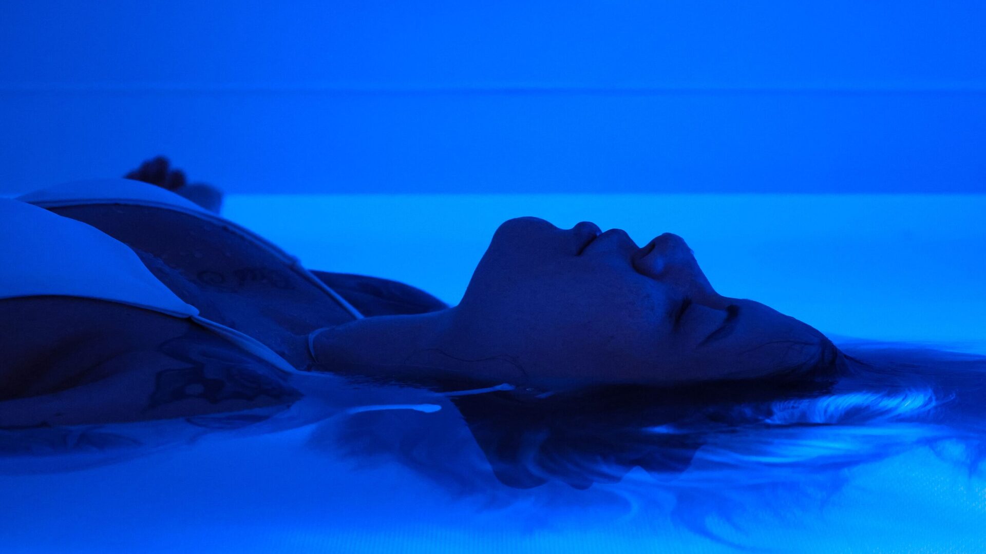 woman utilizing float tank therapy
